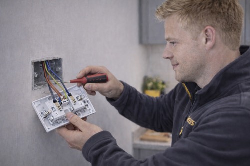 HOMEASSIST engineer working on an electrical installation